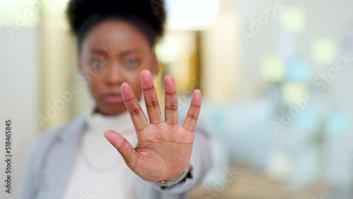 Fighting against racism, oppression and inequality in the workplace. Staying woke about discrimination, harassment and injustices to people of color. Black business woman gesturing to stop with hand. photo