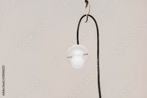 A light bulb hanging from the ceiling photo