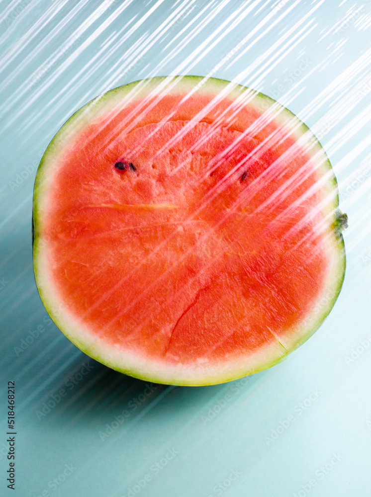 Watermelon behind a transparent plastic layer Watermelon behind a transparent plastic layer