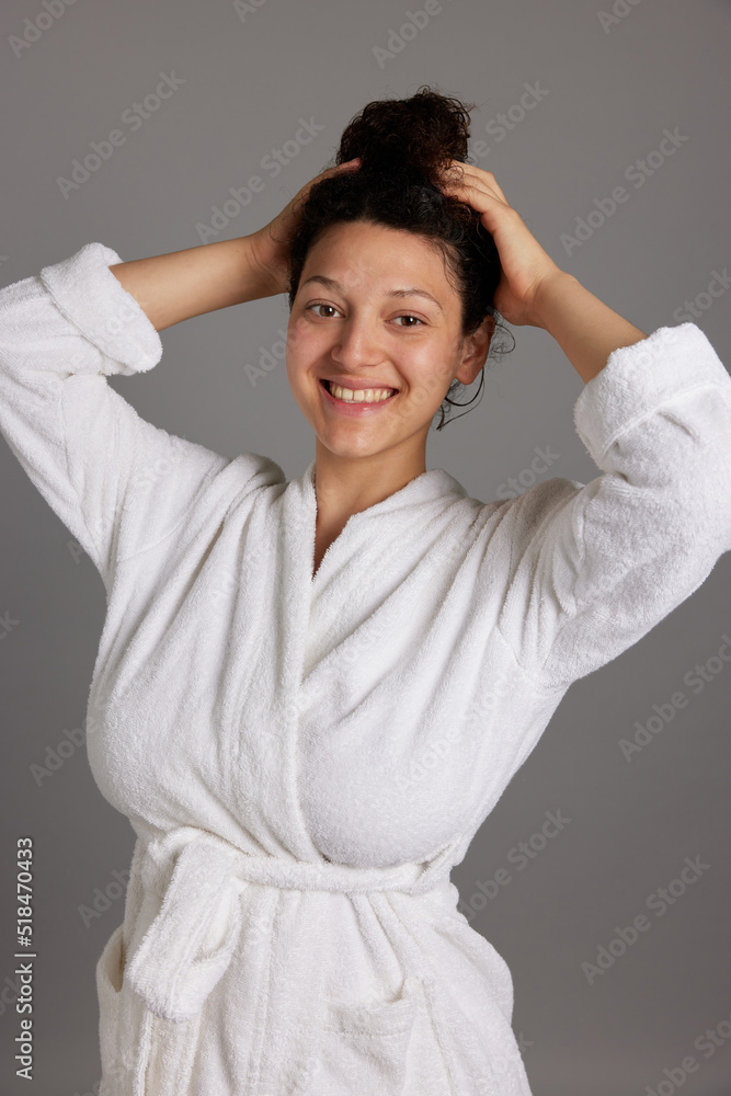 Happy lady touching hair after daily routine procedures