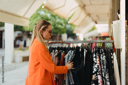 Fashionable woman in a clothes shop for shopping photo