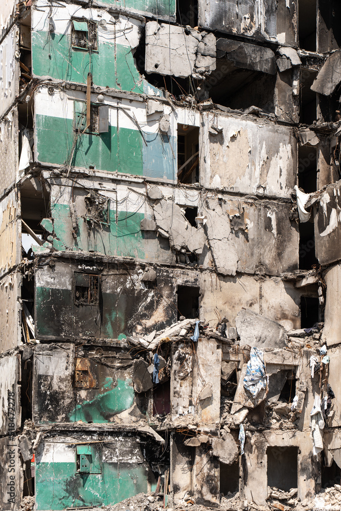 Facade of a bombed-out apartment building. Facade of a bombed-out apartment building.