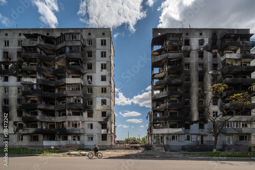 Facade of a bombed-out apartment building.