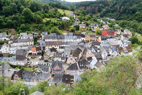 Panorama view on Eifel village Monreal with half-timber houses and river Elsbach, Germany photo