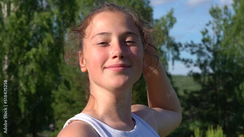 Portrait of a happy teenage girl outside on a sunny summer day Portrait of a happy teenage girl outside on a sunny summer day