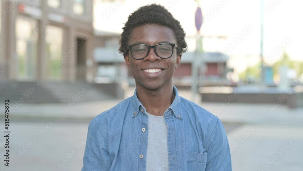 Young African Man Pointing at the Camera and Inviting Outdoor Young African Man Pointing at the Camera and Inviting Outdoor