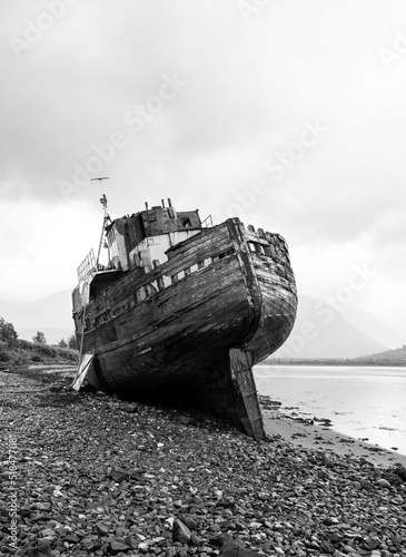 Shipwreck on a shale beach photo