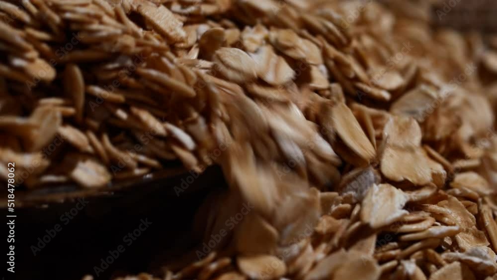 Close-up oatmeal texture, macro oat flakes, vegetarian healthy food background Close-up oatmeal texture, macro oat flakes, vegetarian healthy food background