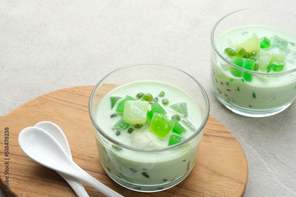 Buko Pandan, a dessert from Philippines, made from jelly, young coconut, evaporated milk, sweetened condensed milk, and ice. Served on glass with cheese topping.
Buko Pandan, a dessert from Philippines, made from jelly, young coconut, evaporated milk, sweetened condensed milk, and ice. Served on glass with cheese topping.