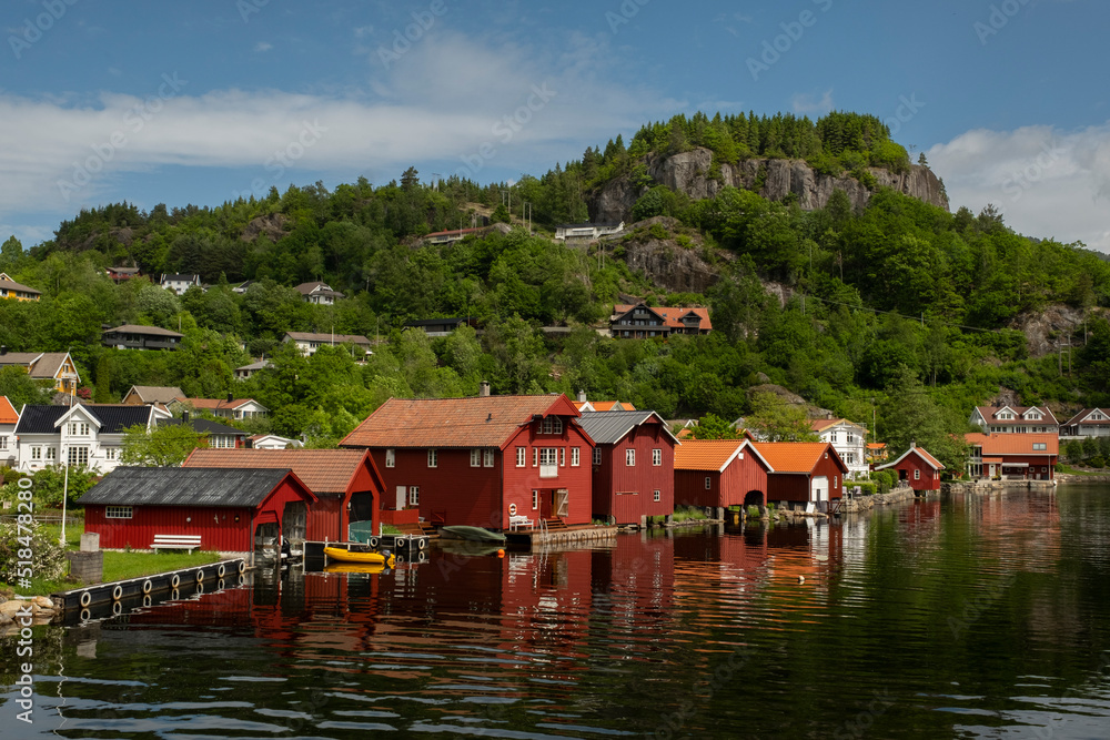 Coastal town. Red garages for boats in Norway Coastal town. Red garages for boats in Norway