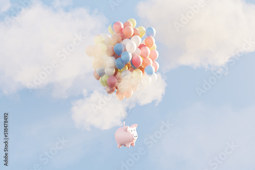 Savings concept: piggy bank floating in sky with balloons photo