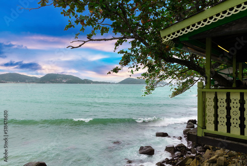 Fototapeta Naklejka Na Ścianę i Meble -  Colourful Skies Sunset over Patong Beach in Phuket island Thailand. Lovely turquoise blue waters, lush green mountains colourful skies and beautiful views of Pa Tong