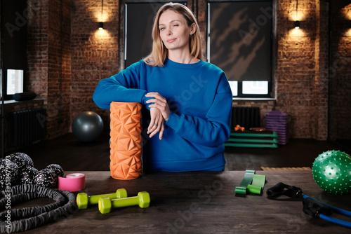 Fitness Trainer With Foam Roller photo