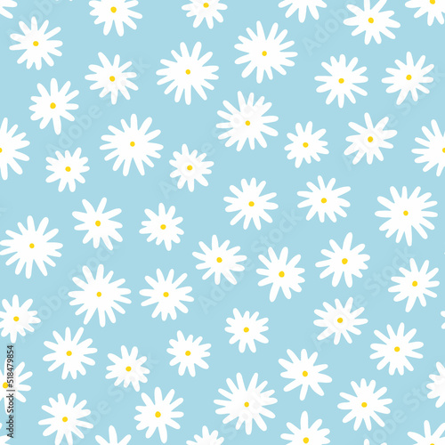 Camomile seamless vector pattern. Hand-drawn white flowers with yellow centers isolated on blue background. Botanical ornament. Cute plant illustration for wallpaper, wrapping paper, clothing, prints