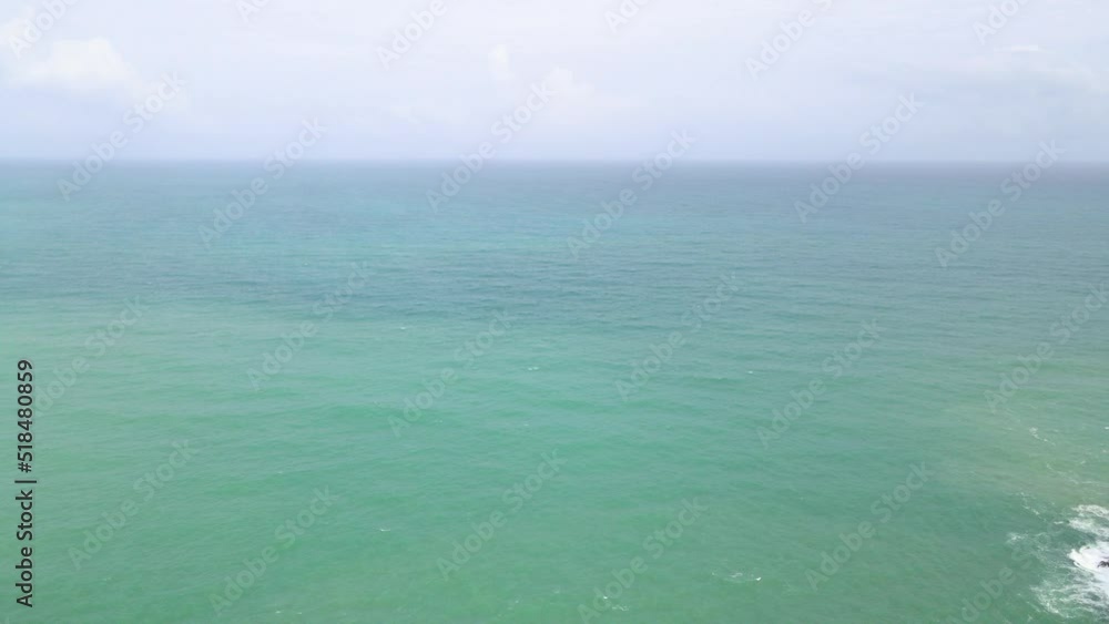 top view ocean blue waves break on sand beach top view ocean blue waves break on sand beach
