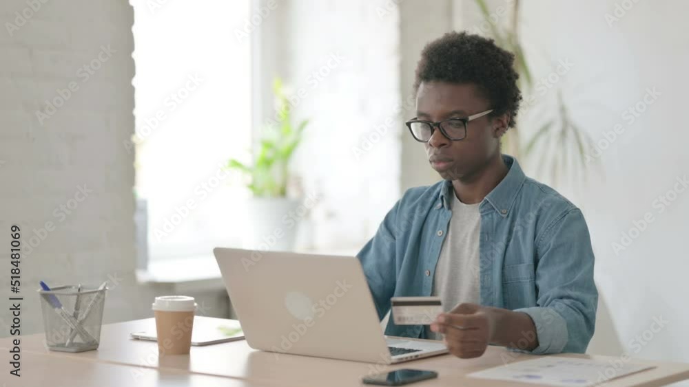 Successful Online Payment on Laptop by Young African Man Successful Online Payment on Laptop by Young African Man