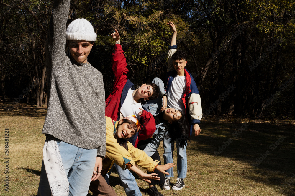 Large group of friends together in a park having fun Large group of friends together in a park having fun