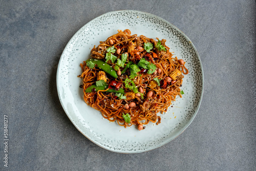 Delicious and spicy homemade meal. Stir Fry Sichuan Mala Noodle with Ground Pork or Pork Slices. Assortments of chili pepper to give the exclusive flavors and tongue numbing  sensation photo