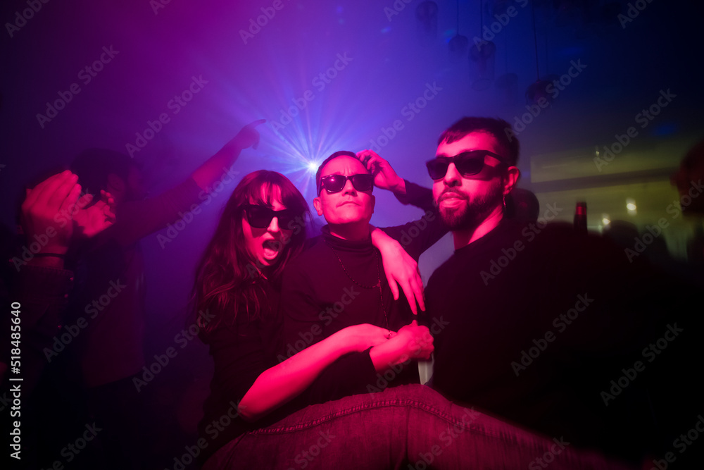 Three friends enjoying wild party at the disco Three friends enjoying wild party at the disco