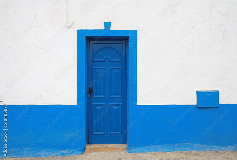 blue door in blue and white wall blue door in blue and white wall