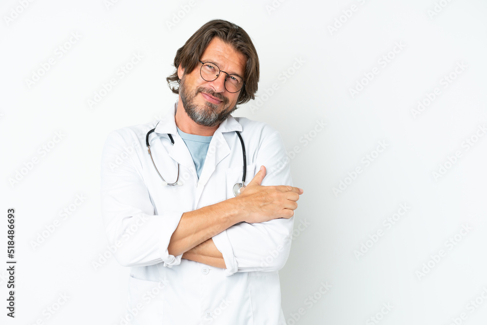 Senior dutch man isolated on white background wearing a doctor gown and pointing side Senior dutch man isolated on white background wearing a doctor gown and pointing side