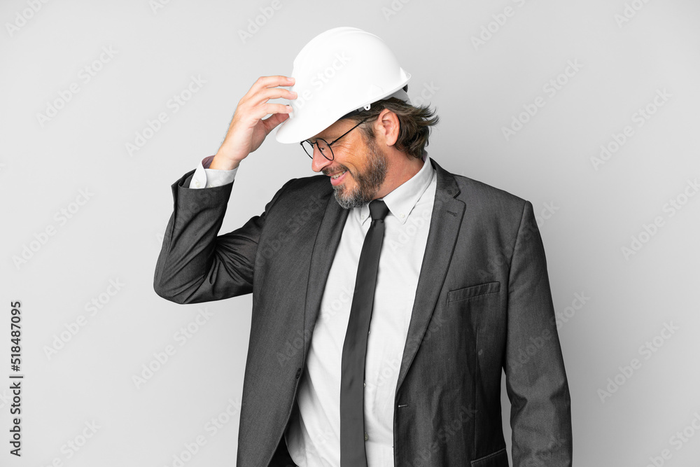 Young architect man with helmet over isolated background laughing Young architect man with helmet over isolated background laughing