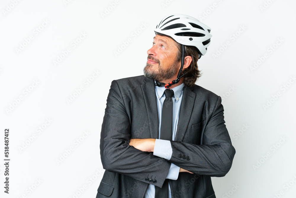 Business senior man with a bike helmet isolated on white background with arms crossed and happy Business senior man with a bike helmet isolated on white background with arms crossed and happy
