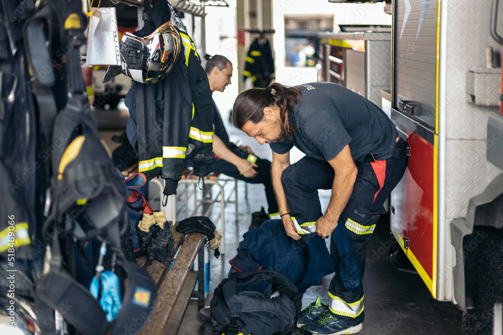 Firefighters working at the fire station Firefighters working at the fire station
