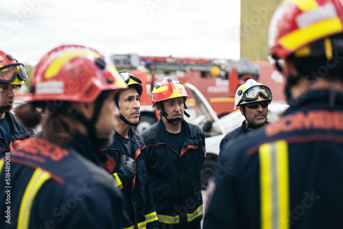 Firefighters meeting while working photo