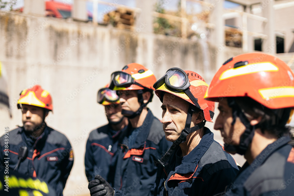Firefighters meeting while working Firefighters meeting while working