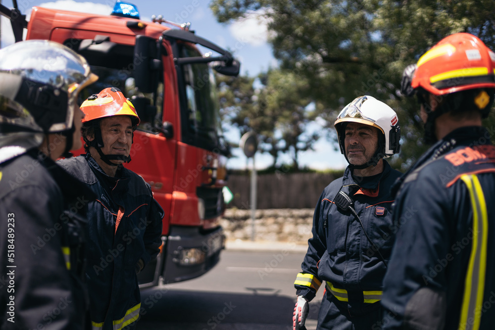 Firefighters working in an emergency on the street Firefighters working in an emergency on the street