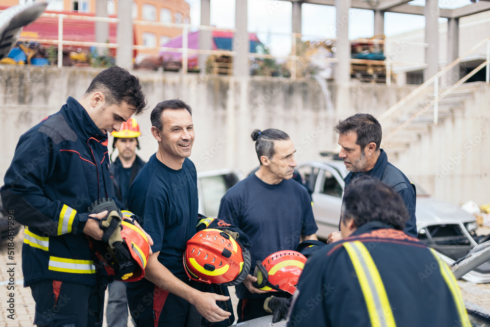 Firefighters working in a parking lot Firefighters working in a parking lot