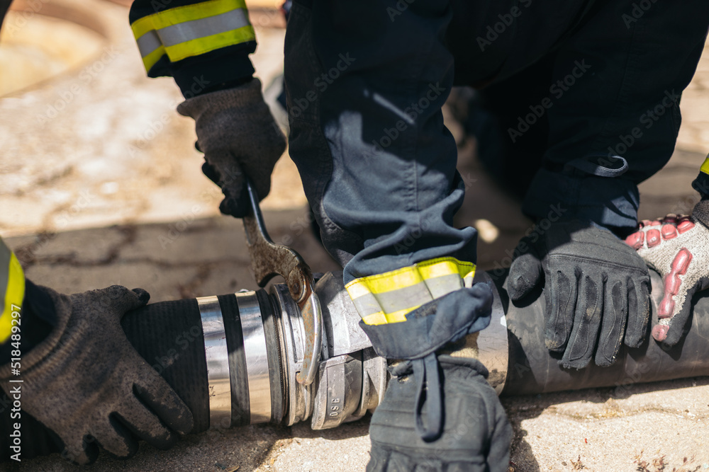 Tight shot of firefighters working Tight shot of firefighters working