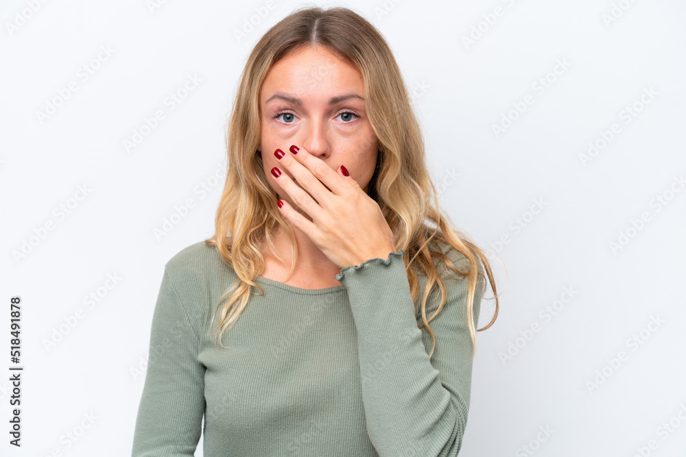 Young Russian woman isolated on white background covering mouth with hand Young Russian woman isolated on white background covering mouth with hand
