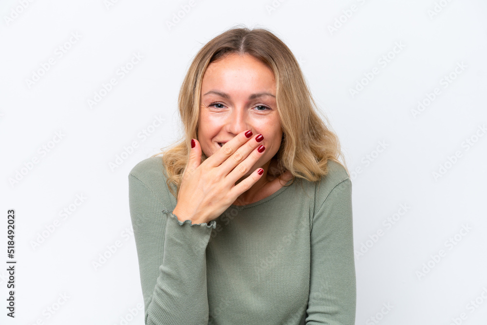 Young Russian woman isolated on white background happy and smiling covering mouth with hand Young Russian woman isolated on white background happy and smiling covering mouth with hand