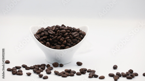 Coffee Beans in Coffee Cup on White Background