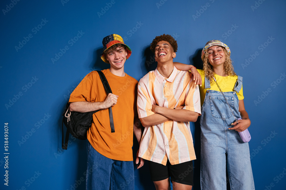 © BONNINSTUDIO/Stocksy - Delighted diverse trendy youngsters in studio