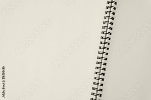 Top view above Open spiral notebook craft paper made from natural material and blank white page texture and minimal style background, page for take notes things to do