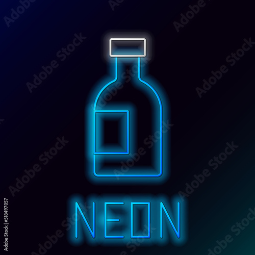 Glowing neon line Glass bottle of vodka icon isolated on black background. Colorful outline concept. Vector