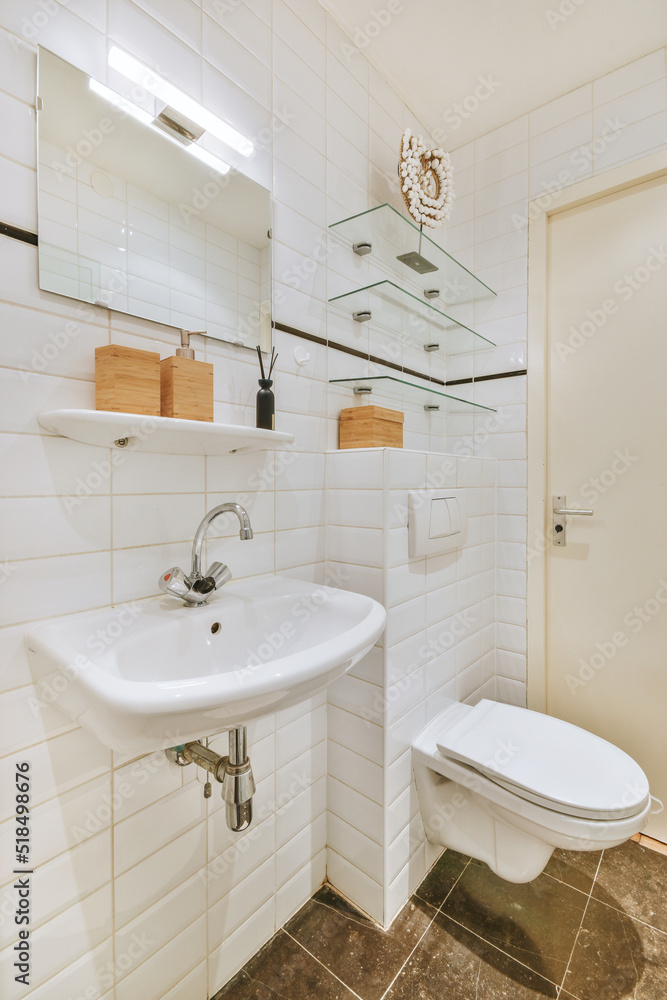 Small white bathroom with toilet and sink Small white bathroom with toilet and sink