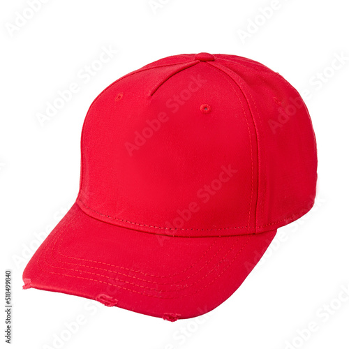 Red textile baseball cap with a visor, isolated on a snow-white background.