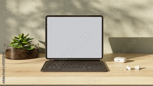 Tablet pc with blank screen on wood table. Aesthetic workplace.  