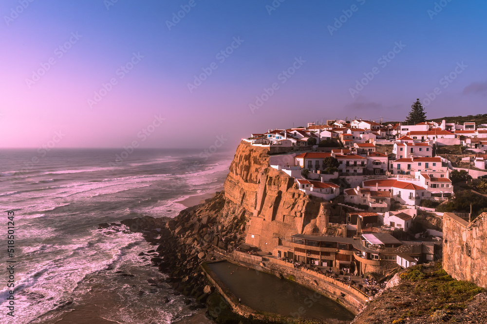 View of the city of Azenhas do Mar over the Atlantic Ocean. Sunset overlooking the city on the coast of the ocean. Azenhas do Mar, Portugal.