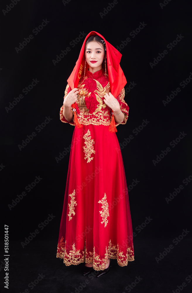 A woman in a red Traditional Chinese wedding dress