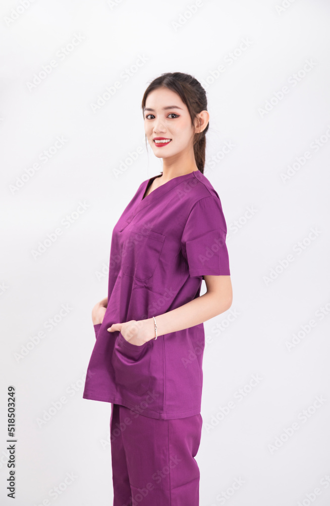 A female nurse in a purple uniform A female nurse in a purple uniform