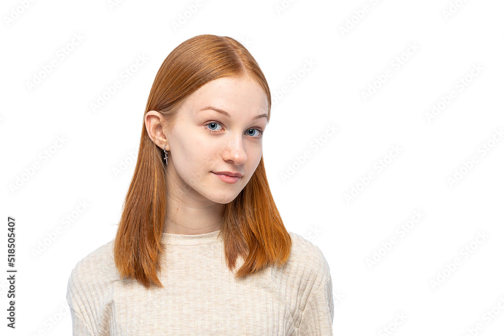 Ginger teenager girl looking at camera. Cute young woman face closeup portrait with healthy clean skin isolated on white background. Copy space. Ginger teenager girl looking at camera. Cute young woman face closeup portrait with healthy clean skin isolated on white background. Copy space.
