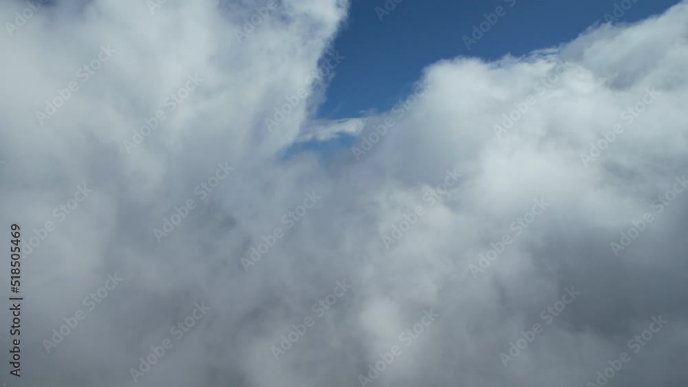 The view from the cockpit, flight among the clouds, blue sky, huge soft clouds. The view from the cockpit, flight among the clouds, blue sky, huge soft clouds.