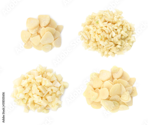 Set with cut fresh garlic on white background, top view
