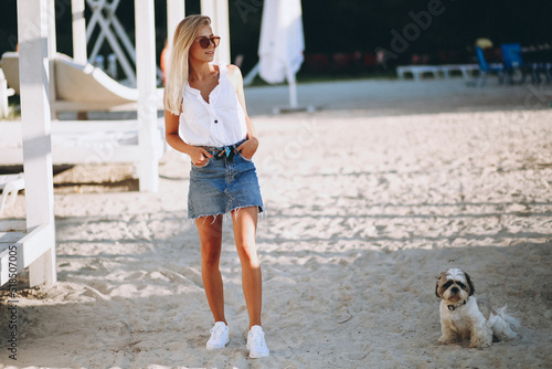 Woman with her dog on a vacation © Petro