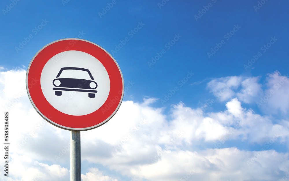 Round car sign transit prohibited for vehicles on a blue sky background. Car road sign, prohibition red sign. Round car sign transit prohibited for vehicles on a blue sky background. Car road sign, prohibition red sign.